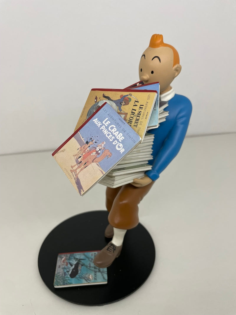 Tintin tenant les albums _ V1